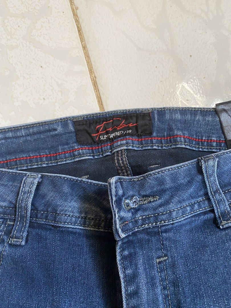 FUBU Slim Tapered Jeans - Size 29 (Category: Jeans) located in Manila. Submitted by kathhhhh236 (Listing ID 1434980893, Image 2). Description: - FUBU slim tapered jeans - Size 29 - Classic blue denim wash - Button closure - Five-pocket design - Machine wash cold, tumble dry low - Leather brand patch - Slim fit.