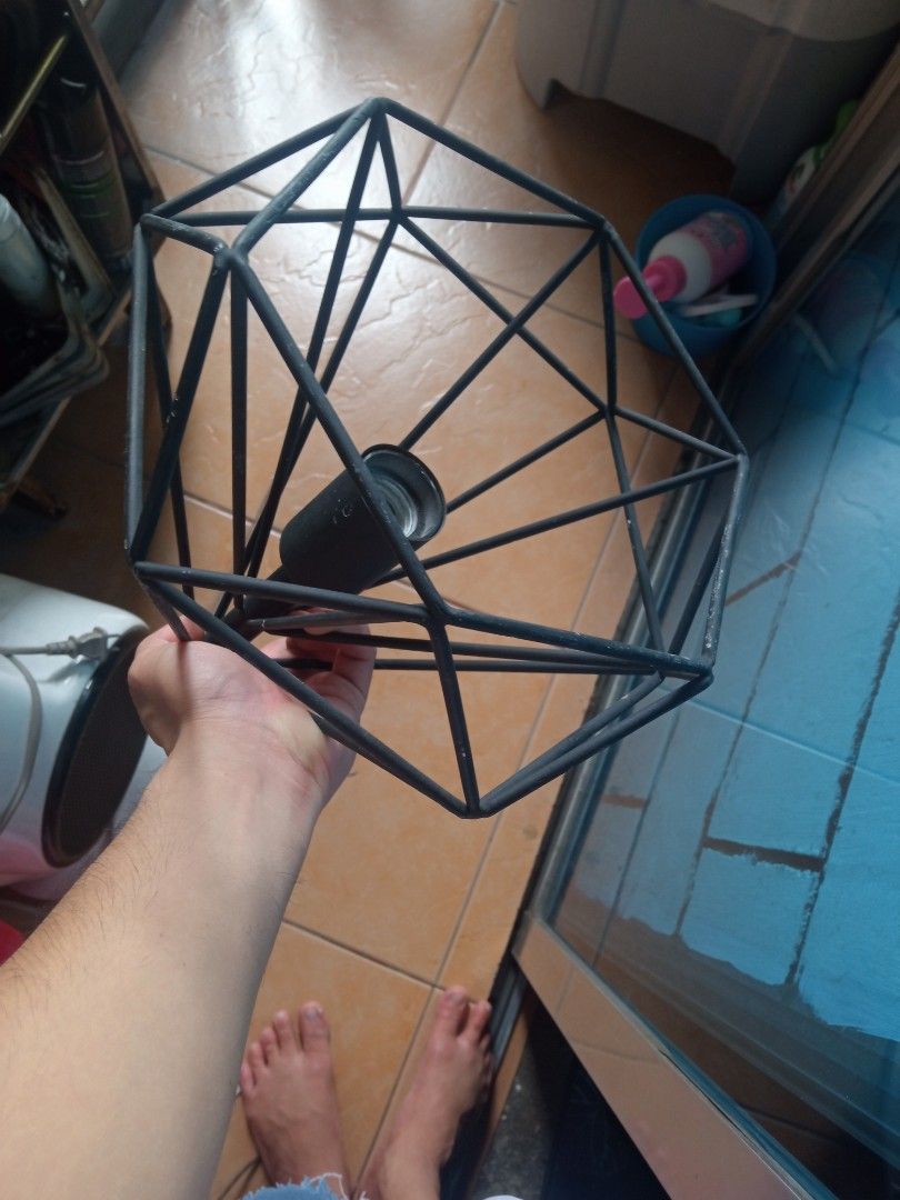 Geometric Cage Pendant Lamp (Category: Lighting) located in Manila. Submitted by studiozero51579 (Listing ID 1434871708, Image 2). Description: - Stylish geometric pendant lamp - Black metal cage design - Includes lamp holder and wiring - Easy to install - Adds a modern touch - Ideal for living rooms, dining areas, or bedrooms - Unique decorative lighting.