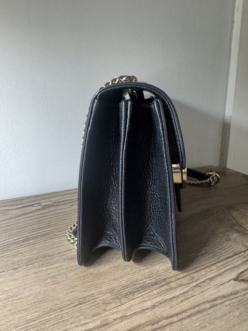 Gucci GG Interlocking Bag (Category: Luxury Bags & Wallets) located in Malolos. Submitted by luxeandlately (Listing ID 1434826673, Image 2). Description: 9.5/10 Comes with cards and dust bag Hairline scratches on hardware but not so noticeable when worn No leather tear or cracks Bought brandnew in Eu Authentic Best price posted The bag in your image is the Gucci Dollar Interlocking GG Shoulder Bag in black. This model is characterized by its text
