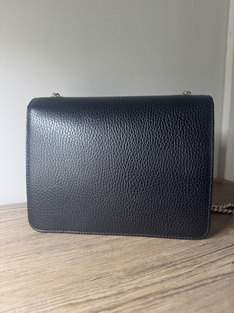 Gucci GG Interlocking Bag (Category: Luxury Bags & Wallets) located in Malolos. Submitted by luxeandlately (Listing ID 1434826673, Image 3). Description: 9.5/10 Comes with cards and dust bag Hairline scratches on hardware but not so noticeable when worn No leather tear or cracks Bought brandnew in Eu Authentic Best price posted The bag in your image is the Gucci Dollar Interlocking GG Shoulder Bag in black. This model is characterized by its text