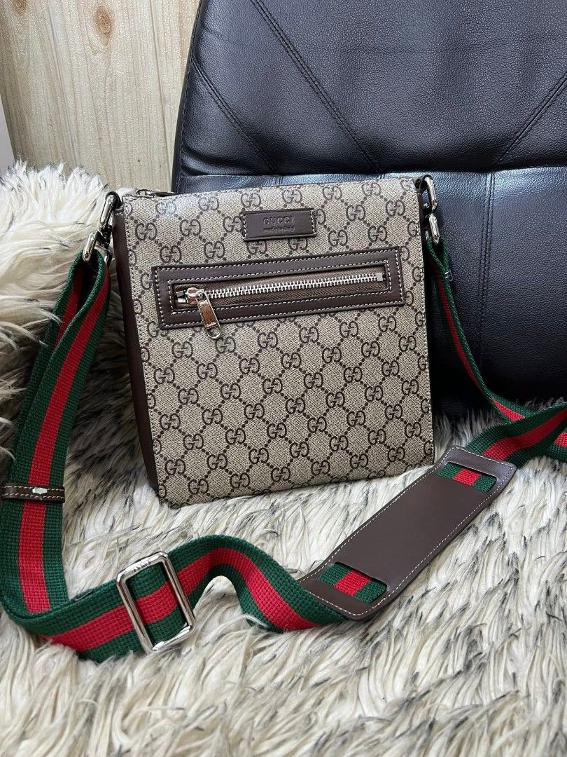 Gucci GG Supreme Messenger Bag (Category: Luxury Bags & Wallets) located in Davao. Submitted by navil01 (Listing ID 1434980853, Image 1). Description: - Gucci messenger bag - Iconic GG Supreme canvas - Zip closure - Adjustable shoulder strap with green and red stripe - Interior pocket - Serial number: 523599 1263.
