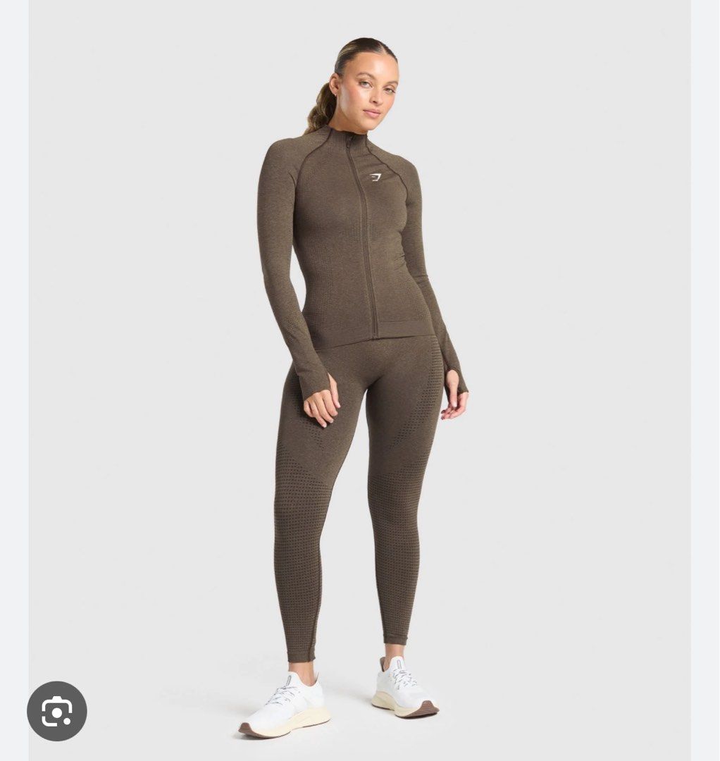 Gymshark Vital Tight Tracktop (Category: Activewear) located in Quezon City. Submitted by chiill (Listing ID 1434989885, Image 2). Description: - Color : Penny Brown Marl - Size: XS, can fit up to Large - Compression - Buttery and Comfy.