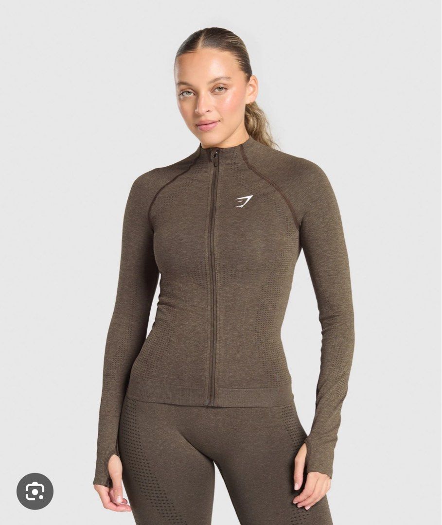 Gymshark Vital Tight Tracktop (Category: Activewear) located in Quezon City. Submitted by chiill (Listing ID 1434989885, Image 1). Description: - Color : Penny Brown Marl - Size: XS, can fit up to Large - Compression - Buttery and Comfy.