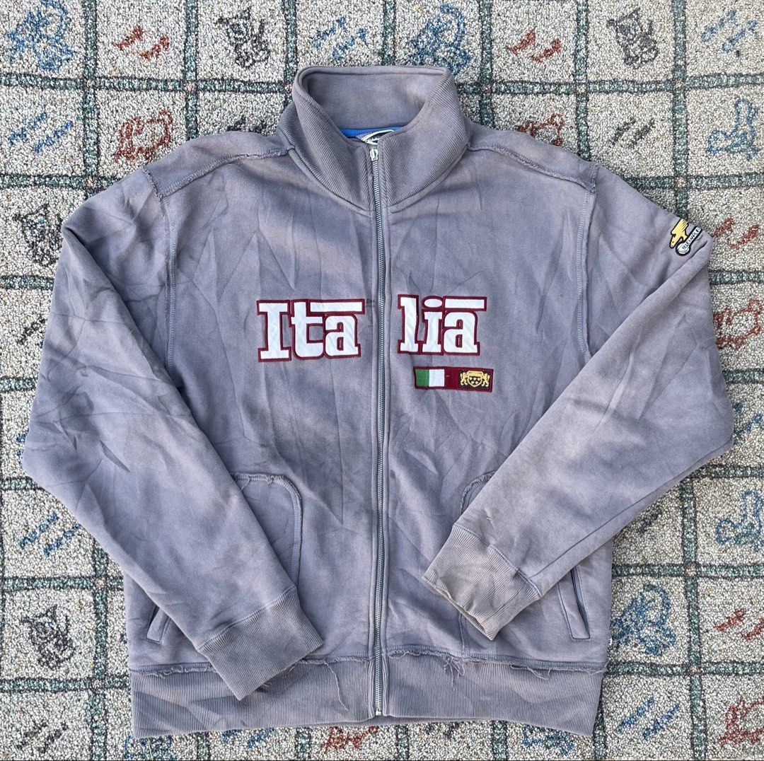 Italia Zip-Up Jacket (Category: Coats, Jackets and Outerwear) located in Manila. Submitted by stepsole (Listing ID 1434995656, Image 1). Description: - Light grey zip-up jacket - Features "Italia" lettering - Italian flag patch - High collar - Two front pockets - Full zipper closure - Distressed sleeves -issue: slider/sun fade.
