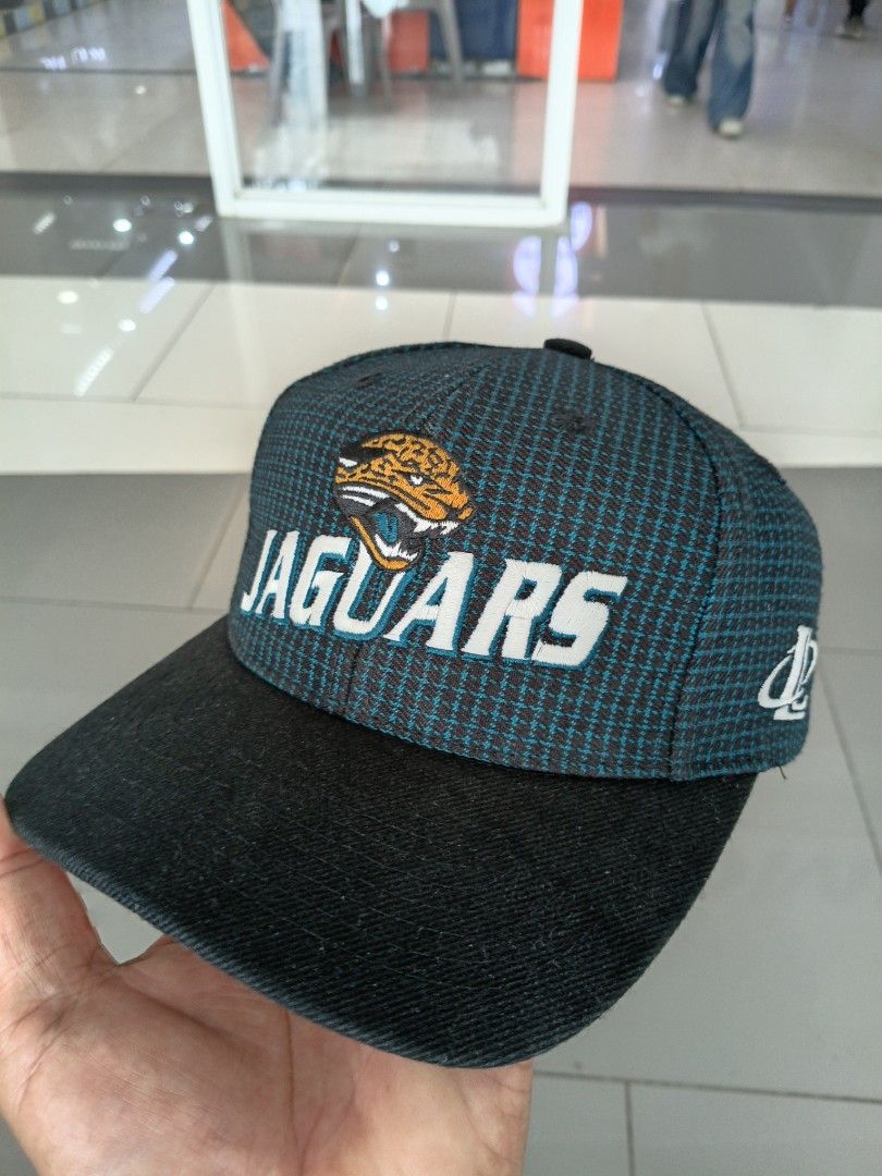 Vintage Jacksonville Jaguars Pro Line Cap (Category: Caps & Hats) located in Dagupan City. Submitted by triefterold76 (Listing ID 1434807664, Image 3). Description: - Jacksonville Jaguars cap - Features team logo on the front - Black brim - Teal and black checkered crown - Includes Pro Line and NFL logos - Inner band reads "Jacksonville".