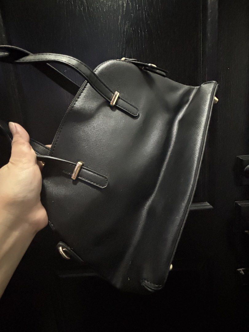 Kate Spade Black Satchel Bag (Category: Luxury Bags & Wallets) located in Manila. Submitted by happyeight (Listing ID 1434921873, Image 2). Description: Kate Spade satchel bag - Black leather - Top handle and detachable shoulder strap - Gold-toned hardware - Interior patterned lining - Features Kate Spade New York logo.