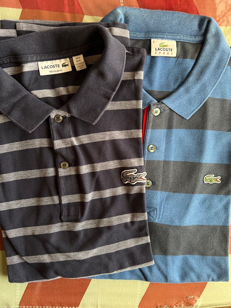 Lacoste Striped Polo Shirts (Category: Tshirts & Polo Shirts ) located in Quezon City. Submitted by stashandstuff (Listing ID 1434899551, Image 1). Description: -Preloved; 100% original - Shirt 1: Blue and grey, "SPORT" label. - Shirt 2: Navy and grey, "REGULAR FIT" label. - Take 2 for only 2800 .