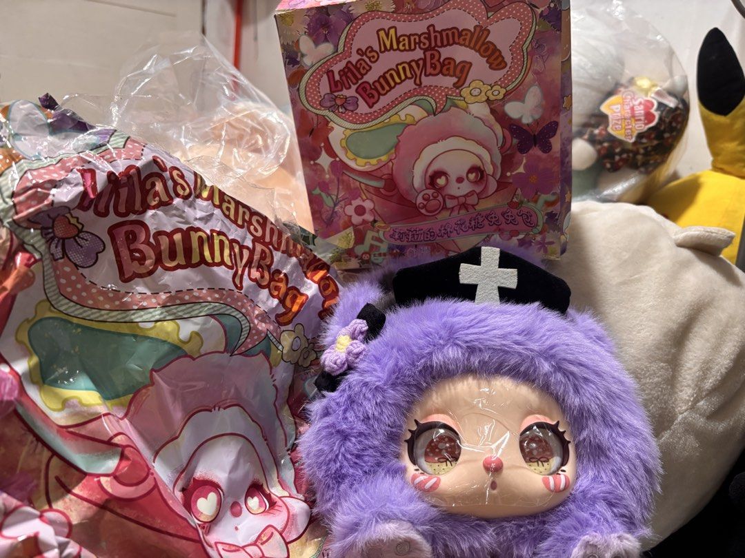 Liila's Marshmallow Bunny Bag (Category: Luxury Bags & Wallets) located in Manila. Submitted by kathylandia (Listing ID 1434994316, Image 1). Description: - Lila's Marshmallow Bunny Bag - Adorable fluffy purple bunny design - Features a cute bunny face and nurse hat - Includes matching strap and box - Brand new, still in original packaging.