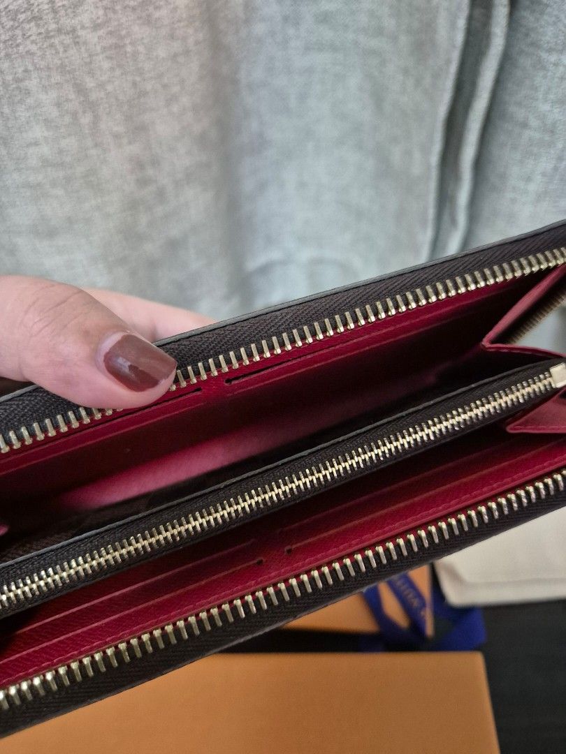 LV Clemence Wallet (2022) (Category: Luxury Bags & Wallets) located in Taguig. Submitted by prelovedbydes1188 (Listing ID 1434883945, Image 3). Description: Louis Vuitton Brown Camvas Damier Ebene Cherry Clemence Wallet bought in 2022. Price: 50% off the retail price Condition: 9.5/10 preowned condition Inclusions: Comes with box and dust bag.