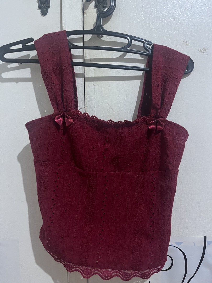 Maroon Lace Top with Bows Red Sleeveless (Category: Sleeveless) located in Manila. Submitted by thelineshopp (Listing ID 1434959955, Image 1). Description: - Maroon lace top - Wide straps with bow accents - Scalloped lace trim (neckline & hem) - Cropped style - Ideal for high-waisted bottoms.