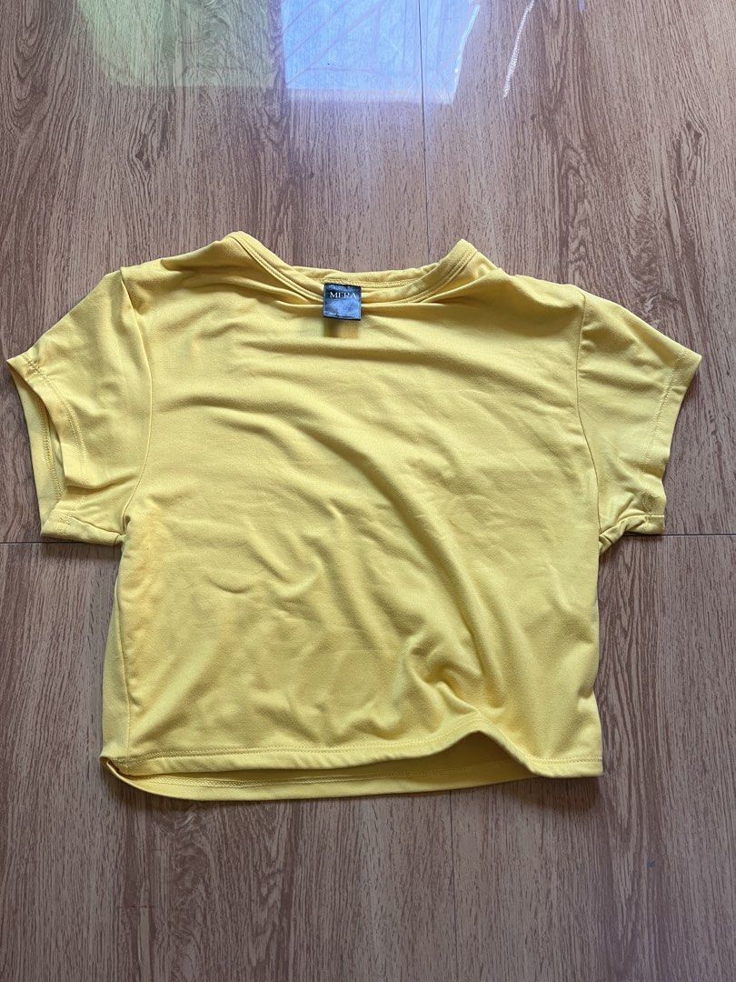 MERA Lila Crop Top in Yellow (Category: Shirts) located in Dagupan City. Submitted by xincr (Listing ID 1434876187, Image 1). Description: - Size: Large on tag, fits XS-S - Length: 15 in. - Width: 13 in. - Bust: 15 in. - Sleeve Length: 9 in. - Condition: 10/10 - Flaws: None - Material: - Price: 150 (FREE SHIPPING FEE).