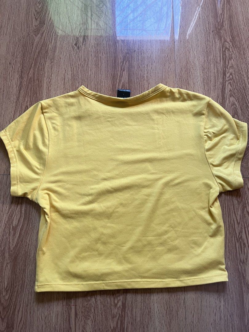 MERA Lila Crop Top in Yellow (Category: Shirts) located in Dagupan City. Submitted by xincr (Listing ID 1434876187, Image 2). Description: - Size: Large on tag, fits XS-S - Length: 15 in. - Width: 13 in. - Bust: 15 in. - Sleeve Length: 9 in. - Condition: 10/10 - Flaws: None - Material: - Price: 150 (FREE SHIPPING FEE).