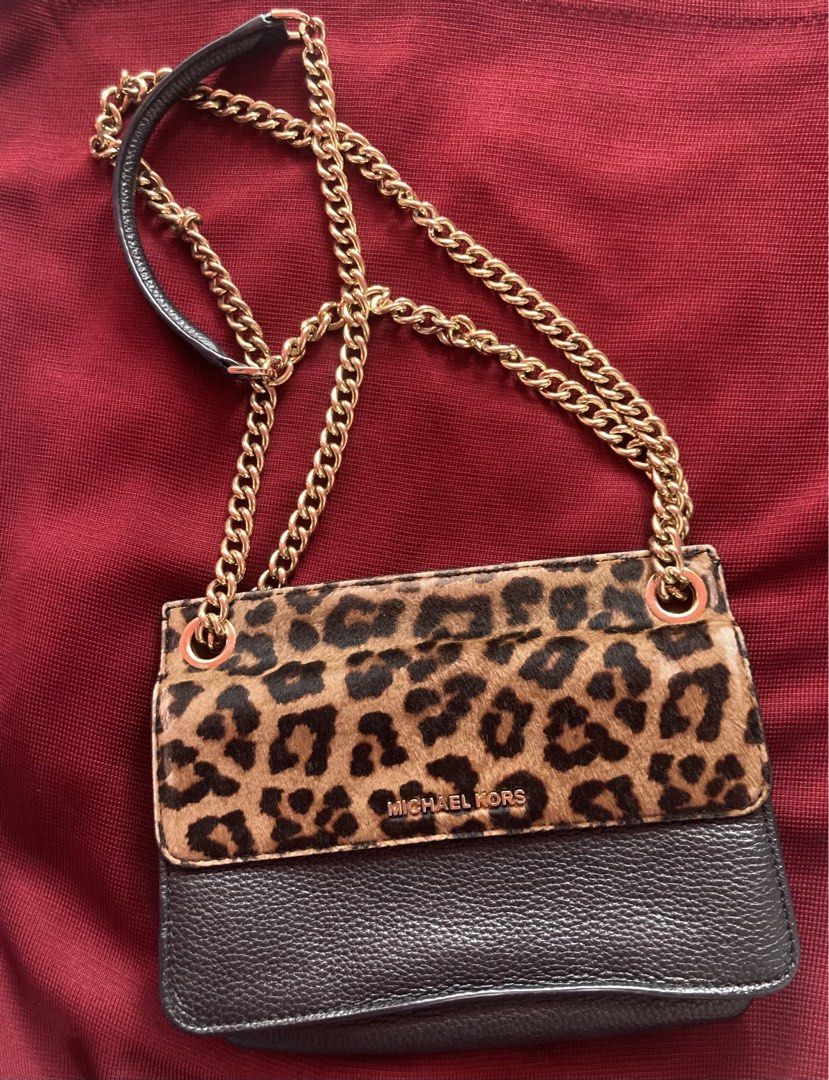 MICHAEL KORS leopard print shoulder bag preloved from personal box (Category: Luxury Bags & Wallets) located in Baguio. Submitted by BreezyRainShop (Listing ID 1434974388, Image 1). Description: This shoulder bag features a distinctive combination of leopard print and black. - Brand: MICHAEL KORS - Design: Leopard print and black combination - Strap: Chain strap - Interior: 2 compartments - Interior: Logo-embossed fabric - Size: Medium From perso