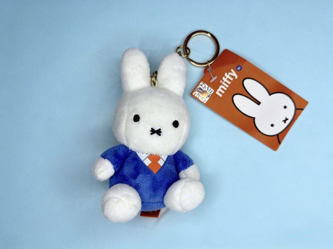 Miffy Plush Keychain (Category: Plushies & Soft Toys) located in Cebu City. Submitted by jessacelo30916 (Listing ID 1434978488, Image 1). Description: - Adorable Miffy plush keychain - Features Miffy wearing a blue outfit with an orange tie - Comes with the original tag - Perfect for keys, bags, or backpacks - A cute and cuddly accessory for Miffy fans.