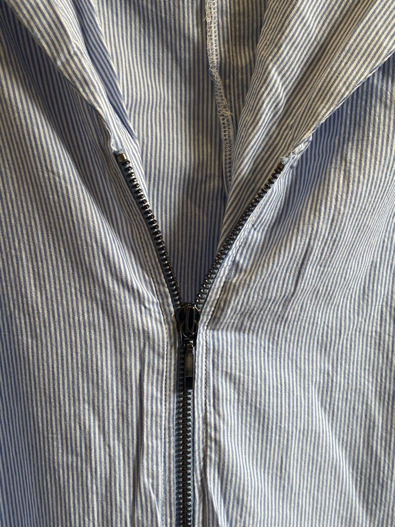 NAO Sleeveless Striped Jumpsuit (Category: Jumpsuits) located in Manila. Submitted by juneqbl (Listing ID 1434862461, Image 2). Description: Sleeveless jumpsuit with zipper. Features a blue and white striped pattern. The brand tag is visible. It has a relaxed fit and a straight leg..