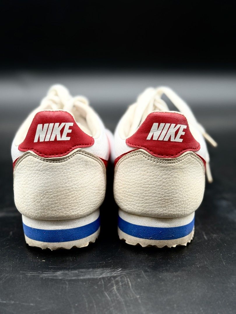 Nike Cortez White Red Blue Sneakers (Category: Sneakers) located in Quezon City. Submitted by opulist (Listing ID 1434965873, Image 2). Description: - 100% AUTHENTIC Nike Cortez sneakers - White with red swooshes and accents - Blue stripe on midsole - Nike logo on heel tab - White laces - minimal wear on soles.