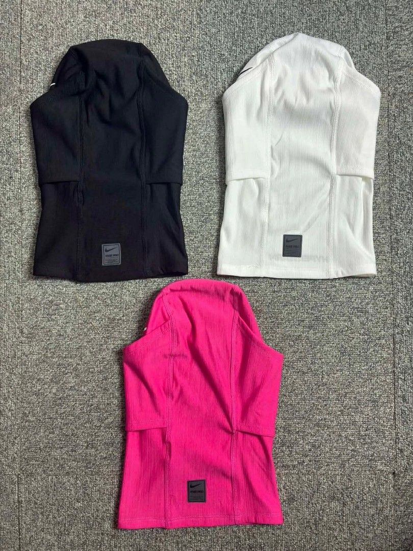 Nike Pro Therma-FIT Hood (Category: Activewear) located in Manila. Submitted by tipaklongthrift (Listing ID 1434840716, Image 3). Description: - Nike Pro Therma-FIT Hood - Available Colors: Black, White, Pink, Camouflage, Camo-like pattern - Features Nike logo - Provides warmth and coverage - Comes with original packaging.