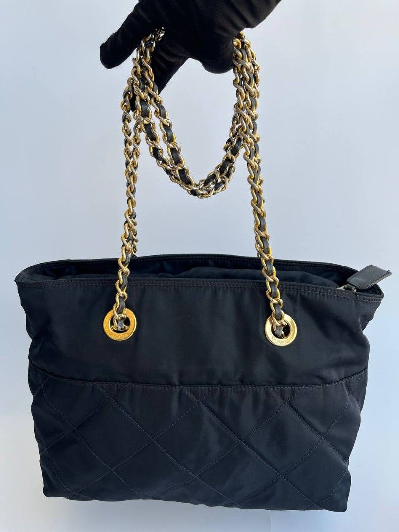 Prada Quilted Nylon Chain Shoulder Bag (Category: Luxury Bags & Wallets) located in Quezon City. Submitted by cornelle_luxuryph (Listing ID 1434948236, Image 2). Description: Prada Quilted Nylon Chain Shoulder Bag Gold-tone chain straps Condition: 8.5-9/10 Very Good, signs of use, tarnishing on the hardware Price: 19,800 pesos only (plus optional legitgrails certificate for 1,300 pesos) 100% authentic | Money back guarantee.