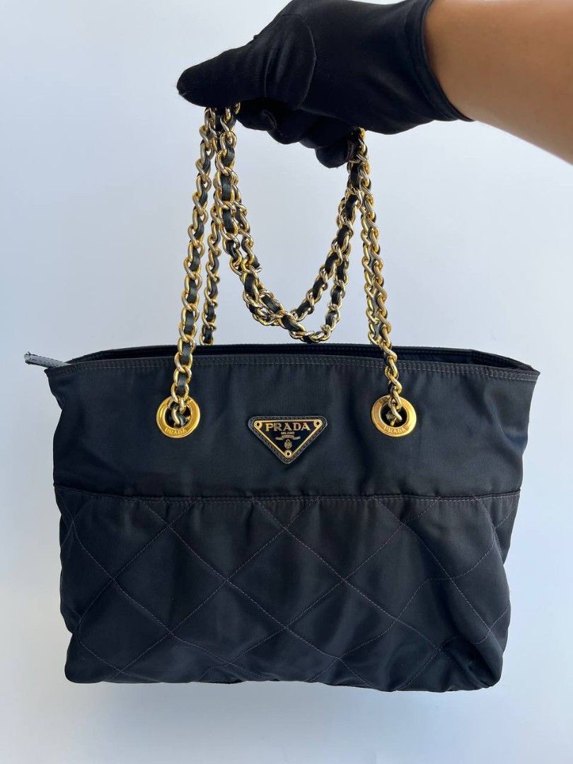Prada Quilted Nylon Chain Shoulder Bag (Category: Luxury Bags & Wallets) located in Quezon City. Submitted by cornelle_luxuryph (Listing ID 1434948236, Image 1). Description: Prada Quilted Nylon Chain Shoulder Bag Gold-tone chain straps Condition: 8.5-9/10 Very Good, signs of use, tarnishing on the hardware Price: 19,800 pesos only (plus optional legitgrails certificate for 1,300 pesos) 100% authentic | Money back guarantee.