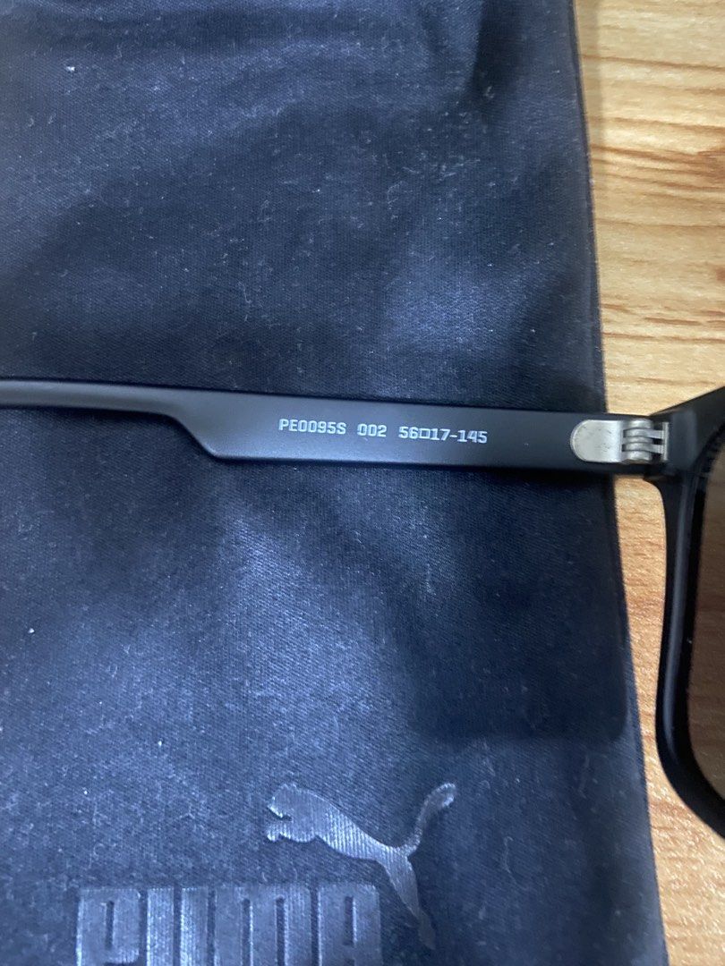 Puma PE0095S Matte Black Sunglasses (Category: Sunglasses & Eyewear) located in Manila. Submitted by revival2hand (Listing ID 1434908755, Image 2). Description: Puma PE0095S Matte Black Sunglasses – Excellent Condition Description: Selling my authentic Puma PE0095S (Color: 002) These feature a classic rectangular frame with a modern matte black finish—perfect for driving, outdoor sports, or daily wear. • Model: PE0095S 002 • Size: 56-17-145 (Stan