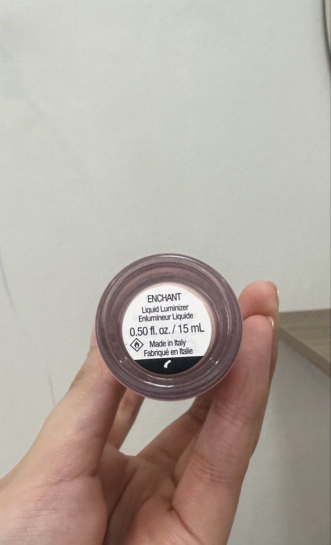 Rare Beauty Liquid Luminizer - Enchant (Category: Makeup) located in Mandaluyong City. Submitted by conclar (Listing ID 1434873951, Image 2). Description: - Rare Beauty Liquid Luminizer in Enchant - Used twice only - price negotiable - Size: 0.50 fl. oz. / 15 mL - Authentic product - Features a clear glass bottle with a light pink cap and white top.