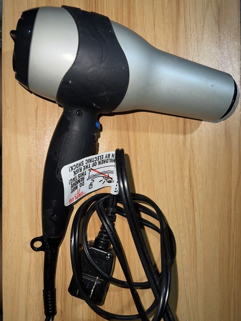 Revlon Hair Dryer with Diffuser (Category: Hair) located in Manila. Submitted by jeimisan (Listing ID 1434995337, Image 1). Description: - Revlon hair dryer with diffuser attachment. - Multiple heat settings: Cool, Warm, Hot. - Stylish silver and black color scheme. - Includes a black power cord and plug. - Diffuser attachment is unused. 110 V.