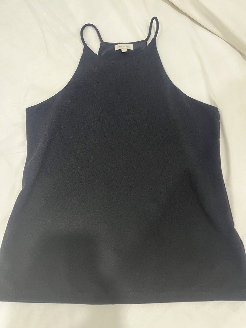 River Island Black Halter Top Size 10 (Category: Sleeveless) located in Manila. Submitted by marianaaa0502 (Listing ID 1434927804, Image 1). Description: - River Island halter neck top - Solid black color - Size: 10 - Features thin straps - Textured fabric - Versatile design.