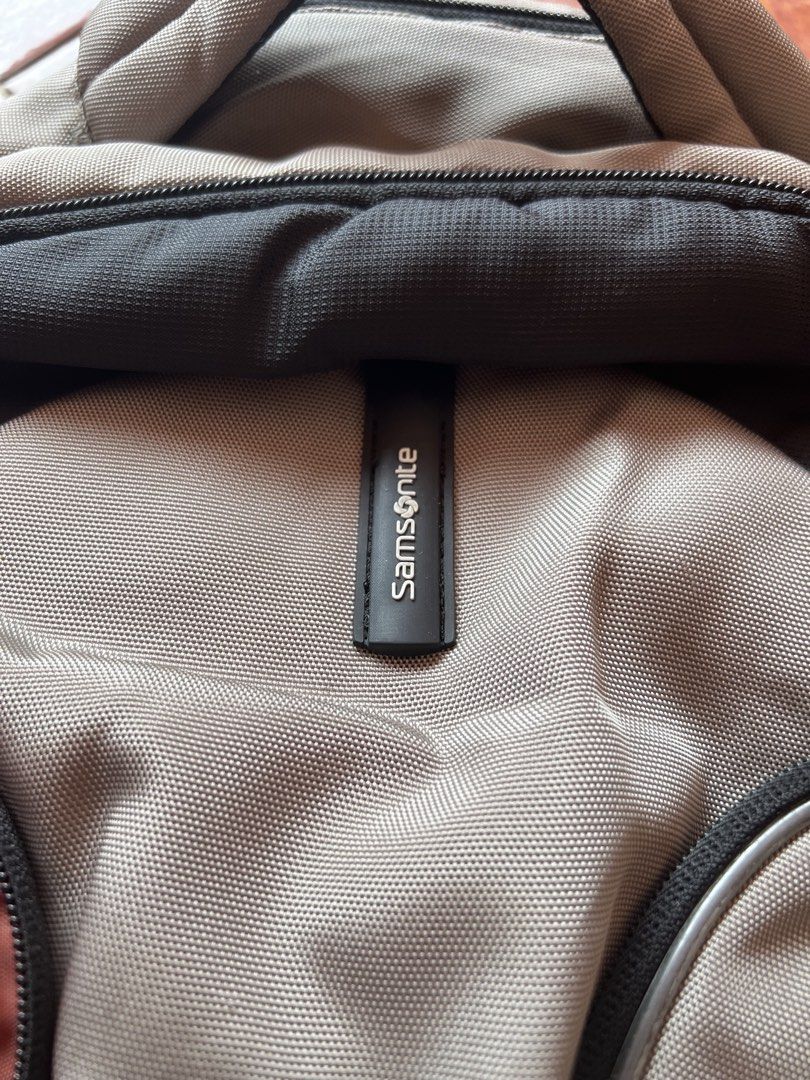 Samsonite Backpack (Category: Backpacks) located in Kuala Lumpur. Submitted by natnat0508 (Listing ID 1434910461, Image 2). Description: - Samsonite backpack - Multiple compartments and pockets - Padded back and shoulder straps - Top handle - Side pockets - Separate interior compartment - some zips are broken so have to use keychain to attach to open and close.