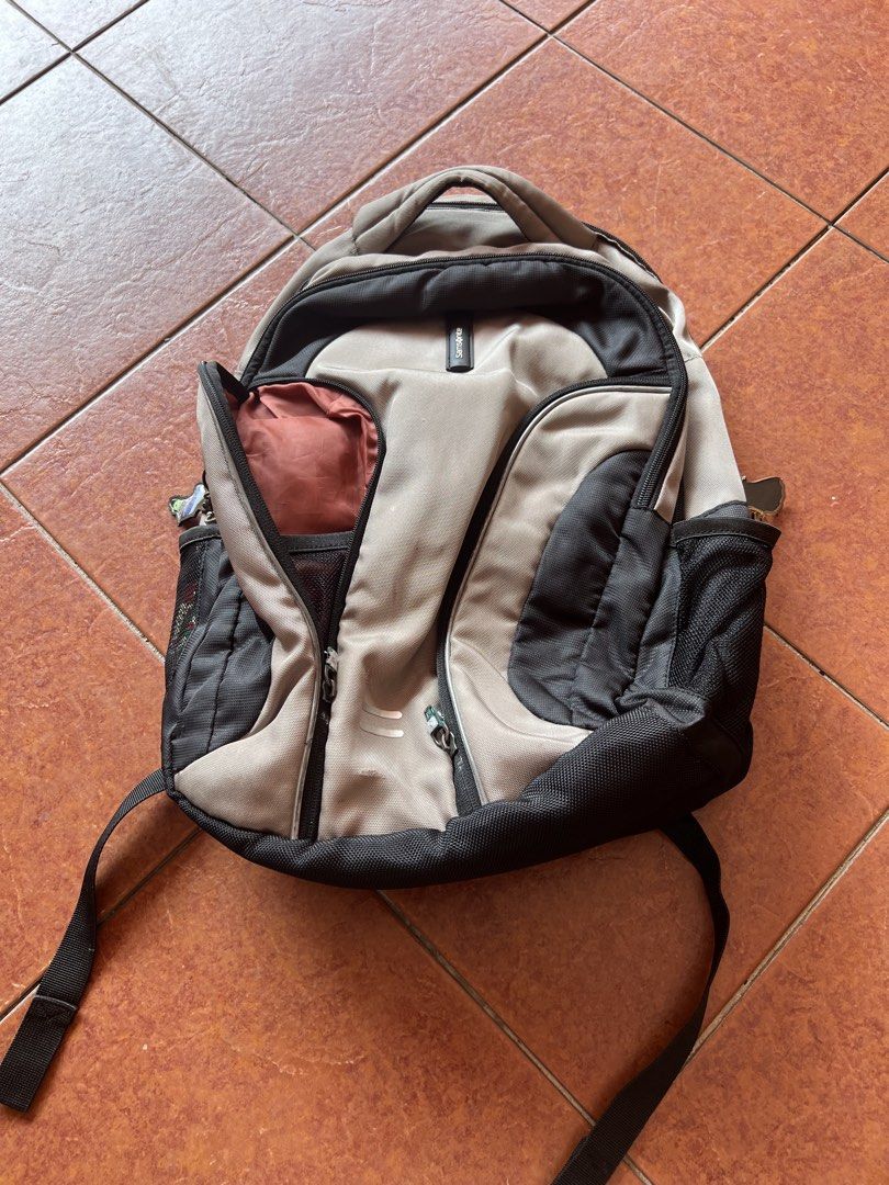 Samsonite Backpack (Category: Backpacks) located in Kuala Lumpur. Submitted by natnat0508 (Listing ID 1434910461, Image 1). Description: - Samsonite backpack - Multiple compartments and pockets - Padded back and shoulder straps - Top handle - Side pockets - Separate interior compartment - some zips are broken so have to use keychain to attach to open and close.