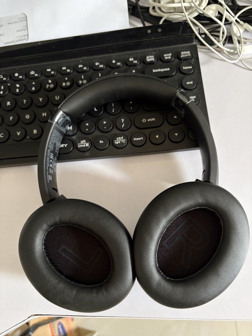 Soundcore Headphones (Category: Headphones & Headsets) located in Angono. Submitted by _jenelyn (Listing ID 1434861938, Image 2). Description: - Soundcore over-ear headphones - Color: Black - Bought 3 weeks ago - Earcups marked with "L" and "R" - Button controls on the right earcup - Padded headband for comfort - Includes a protective pouch.