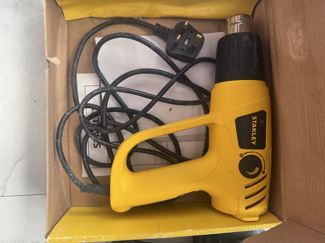 Stanley Heat Gun (Category: Construction Tools & Equipment) located in Muntinlupa City. Submitted by gagfl (Listing ID 1434813570, Image 1). Description: - Stanley heat gun in original box - Variable temperature control - Includes power cord and manual - Yellow and black color - UK plug.
