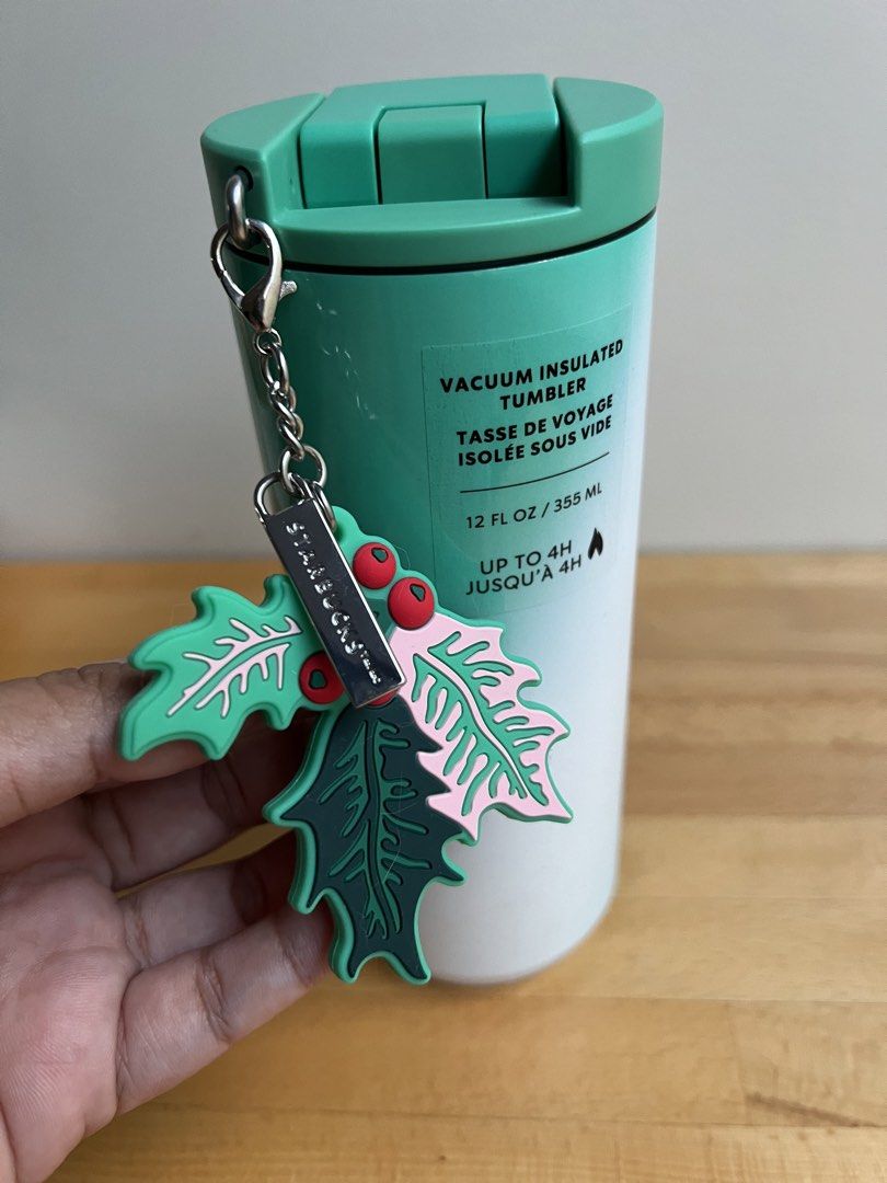 Starbucks 2024 Christmas Vacuum Insulated Tumbler with Holly Charm 12oz (Category: Water Bottles & Tumblers) located in Quezon City. Submitted by prebyflo (Listing ID 1434913874, Image 2). Description: Bought in the US Limited Edition Gradient colorway Holly Starbucks charm is removable so you can put your own! (See last photo. Cat charm not included 😊) Used once then stored No issues.