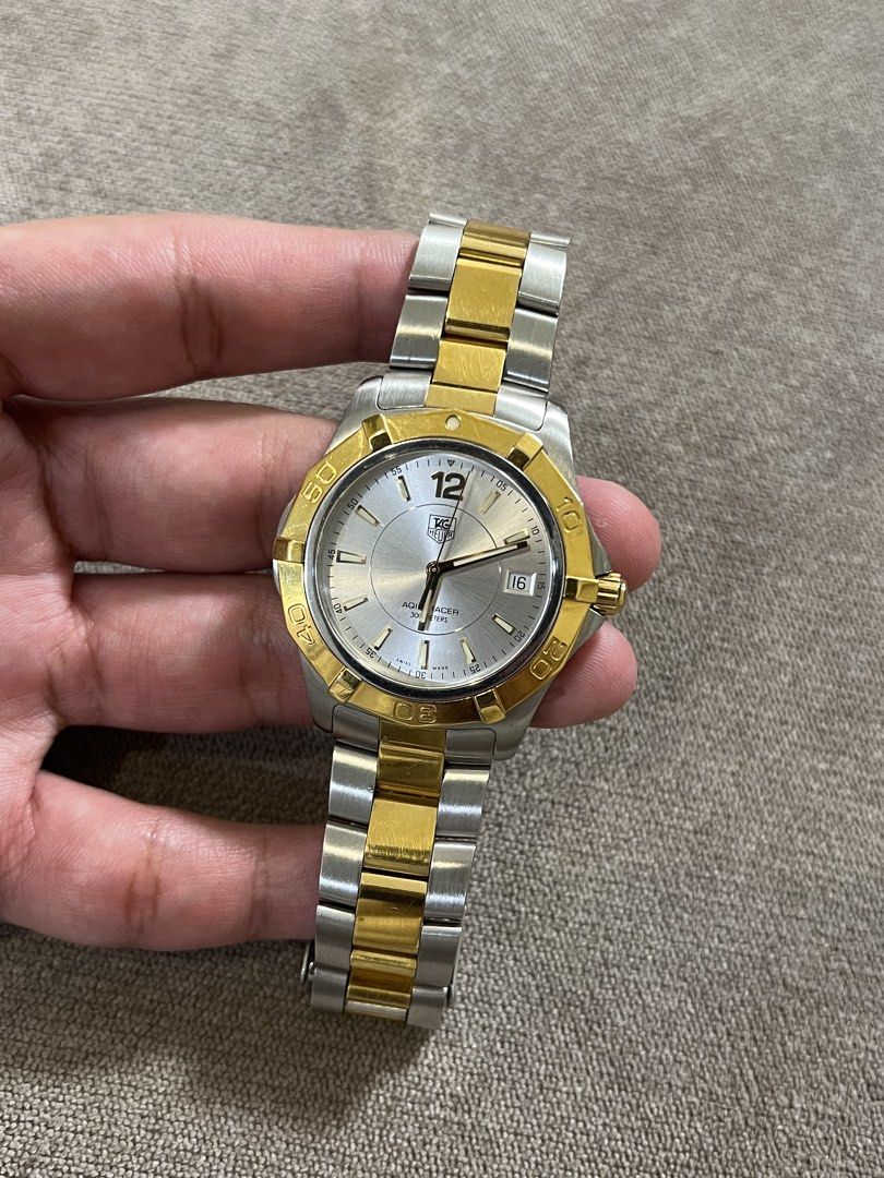 Tag Heuer Aquaracer (Category: Luxury Watches) located in Makati City. Submitted by stevenbravo (Listing ID 1434981474, Image 2). Description: - Tag Heuer Aquaracer - Silver dial with gold-tone accents - Date display - Water-resistant to 300 meters - Model details on case back - Ref: WAF 1120 - Watch only - 41mm case Price: 46,500 Slightly Negotiable! .