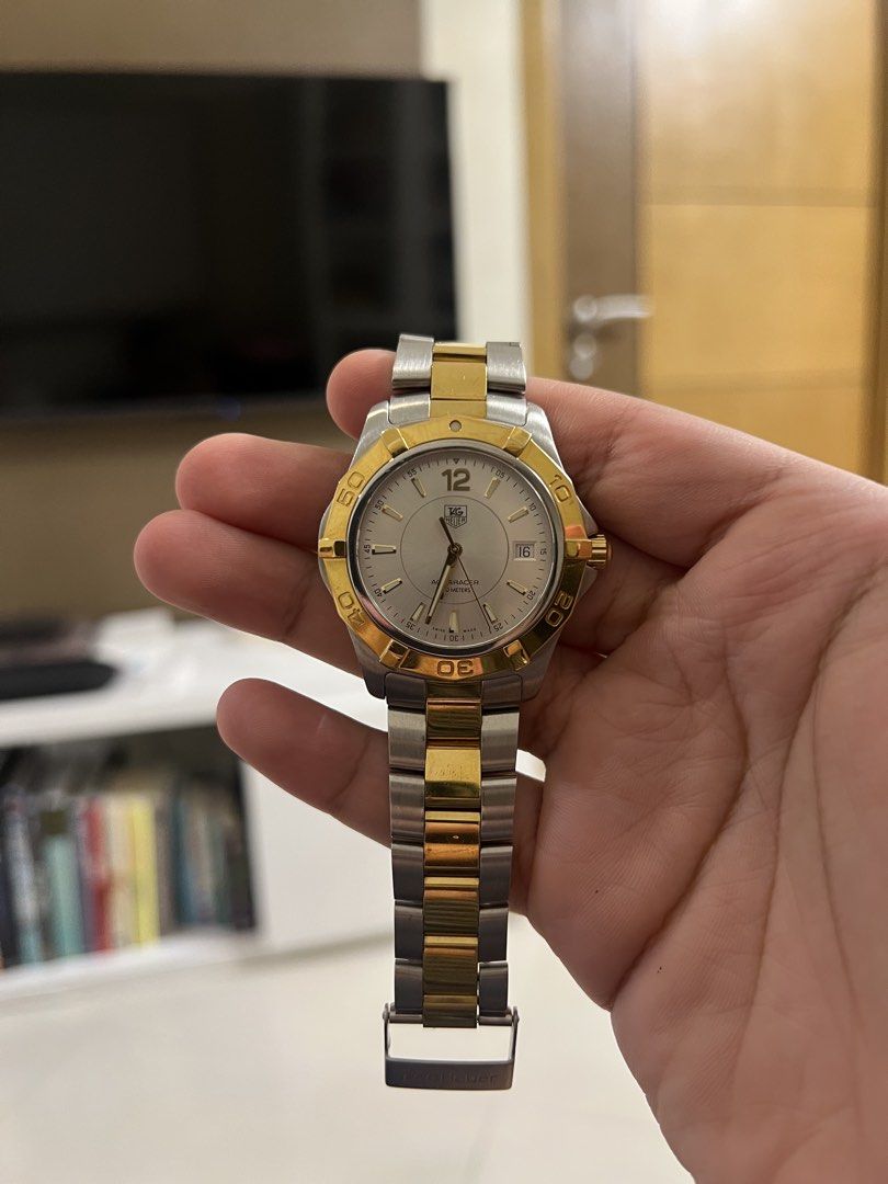 Tag Heuer Aquaracer (Category: Luxury Watches) located in Makati City. Submitted by stevenbravo (Listing ID 1434981474, Image 1). Description: - Tag Heuer Aquaracer - Silver dial with gold-tone accents - Date display - Water-resistant to 300 meters - Model details on case back - Ref: WAF 1120 - Watch only - 41mm case Price: 46,500 Slightly Negotiable! .