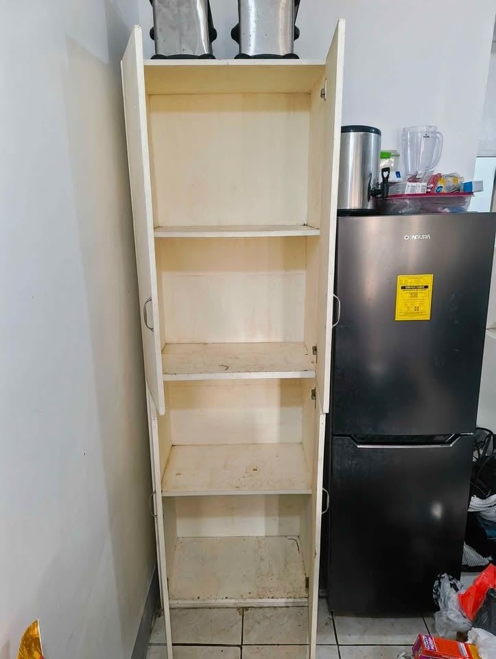 Tall White Cabinet with Shelves (Category: Shelves, Cabinets & Racks) located in Meycauayan. Submitted by kocoshibo07 (Listing ID 1434868867, Image 2). Description: - Tall white wooden cabinet - Features four doors - Includes multiple shelves for storage - Suitable for kitchen or other storage needs - Simple and practical design -Heavy Duty Rush Sale! Price Negotiable .