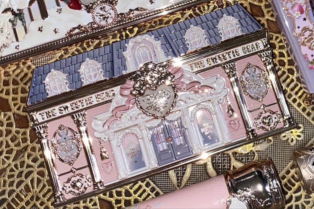 The Sweetest Bear Eyeshadow Palette (Category: Makeup) located in Manila. Submitted by fiercefleur (Listing ID 1434810086, Image 1). Description: - Flower Knows Strawberry Rococo Eyeshadow Palette – 01 Strawberry Macaron - Eyeshadow palette with a unique building facade design. - Features a variety of eyeshadow shades. - Includes a convenient mirror. - Contains a mix of light and darker colors. - Ornate packaging in a pink and gold color scheme..