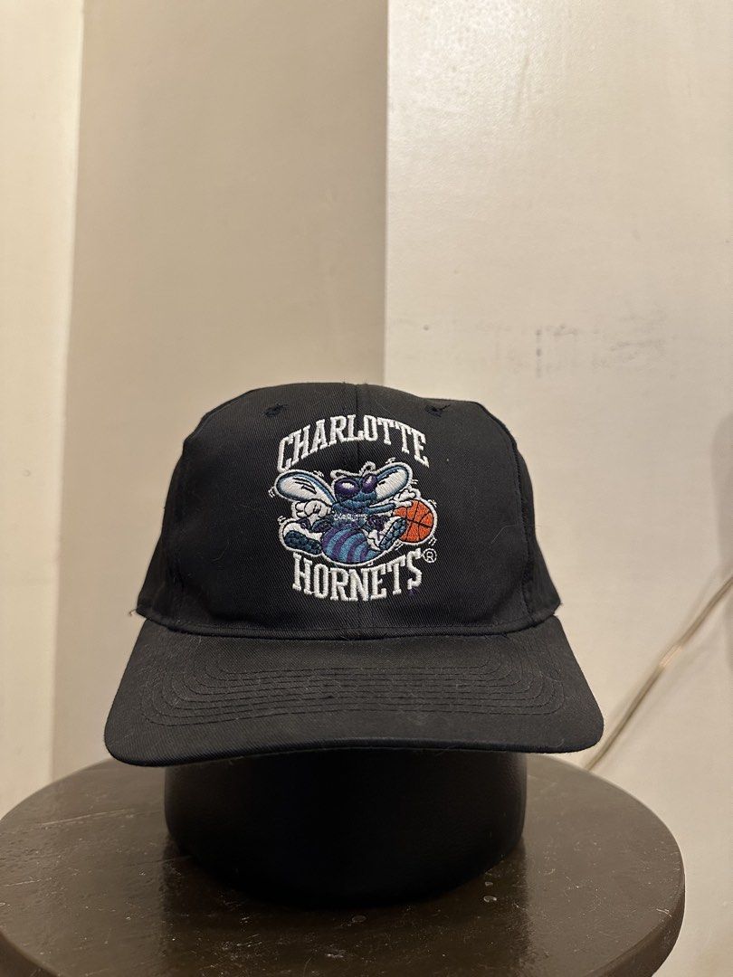 Vintage Charlotte Hornets NBA Cap (Category: Caps & Hats) located in Bacoor. Submitted by realbacktrack (Listing ID 1434888867, Image 1). Description: - Charlotte Hornets cap - Features Hornets logo on the front - "HORNETS" text on the back - Official NBA product by First Pick - Size: L - Material: 65% polyester, 35% cottonm *minor signs of usage.