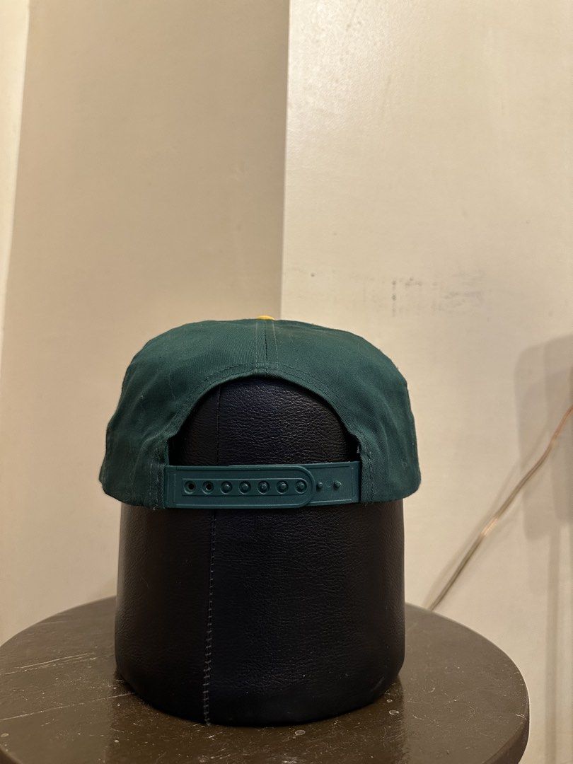 Vintage Green Bay Packers Cap (Category: Caps & Hats) located in Bacoor. Submitted by realbacktrack (Listing ID 1434888674, Image 2). Description: - Vintage Green Bay Packers cap - Features the iconic team logo - "PACKERS" embroidered below the logo - Classic green crown and yellow brim - Adjustable green strap for a perfect fit - White interior lining with team logo - Made by Eastport *signs if usage *stains inside (see pictures).