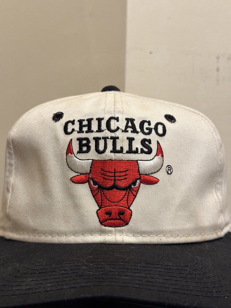 Vintage OG LOGO Chicago Bulls Cap (Category: Caps & Hats) located in Bacoor. Submitted by realbacktrack (Listing ID 1434889472, Image 2). Description: - Vintage Chicago Bulls cap - Iconic bull logo - White crown with black embroidery - Black brim - Adjustable strap - Green underside - Classic snapback design *snap issue (see pictures) *signs of usage * needswash.