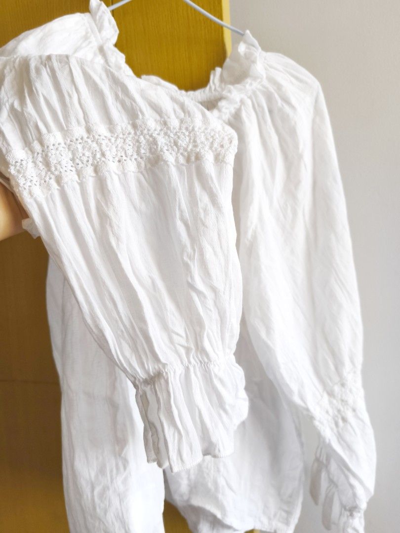 White Button-Down Blouse (Category: Blouses) located in Taguig. Submitted by deyerreC2020 (Listing ID 1434864330, Image 3). Description: premium blouse White button-down blouse with round gartered neckline, long sleeves; 100%cotton and ruffled cuffs. Bust: 46 inches. Textured fabric with decorative details. for NCR area all items free Ship out minimum 300 Up....