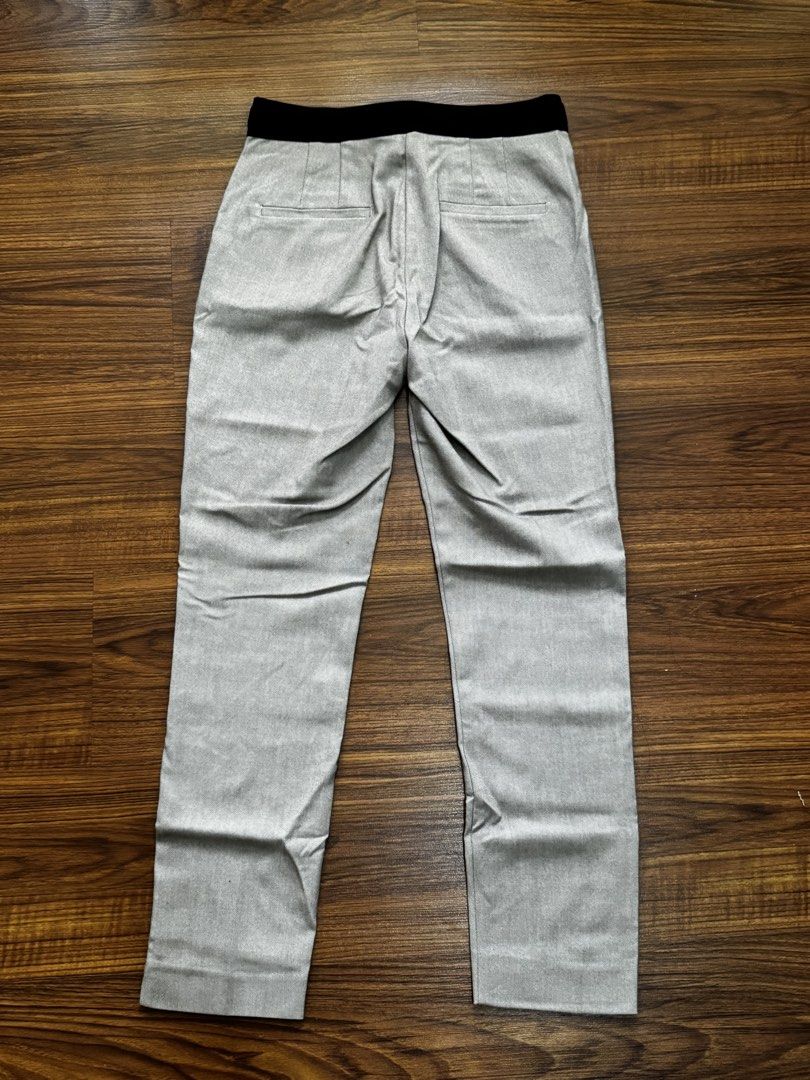 Zara Beige-Light Gray Slim Trousers (Category: Other Bottoms) located in Quezon City. Submitted by mkr888 (Listing ID 1434901392, Image 2). Description: Hi! Selling my Zara Slim trousers. It is beige-light gray ish color. Garterized back, button and clip and zipper closure. It has 2 front pockets, and 2 faux back pockets. Never been used. Only stored. Guaranteed store bought. Still in excellent condition. My price is slightly negotiable :) Paymen