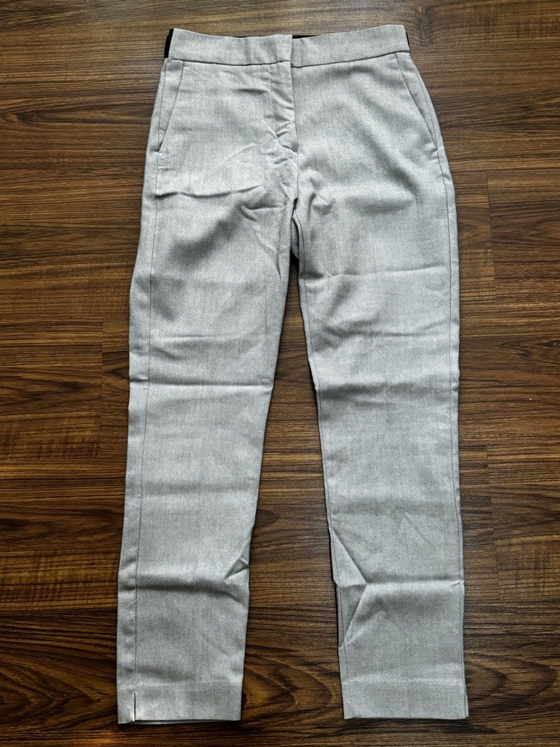 Zara Beige-Light Gray Slim Trousers (Category: Other Bottoms) located in Quezon City. Submitted by mkr888 (Listing ID 1434901392, Image 1). Description: Hi! Selling my Zara Slim trousers. It is beige-light gray ish color. Garterized back, button and clip and zipper closure. It has 2 front pockets, and 2 faux back pockets. Never been used. Only stored. Guaranteed store bought. Still in excellent condition. My price is slightly negotiable :) Paymen