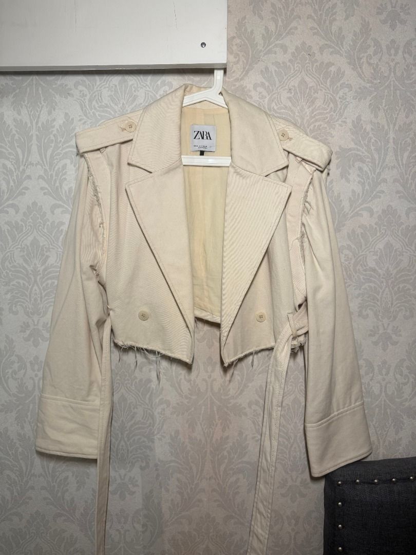Zara Cropped Jacket with Detachable Sleeves (Category: Coats, Jackets and Outerwear) located in Muntinlupa City. Submitted by clauisstuff (Listing ID 1434916222, Image 1). Description: Zara cream cropped jacket with detachable sleeves - Has buttons on sleeves - Includes a belt - Decorative shoulder details - Raw, frayed hemline RFS: Decluttering MOP: BDO/BPI/GoTyme LOC: Muntinlupa/Taguig.