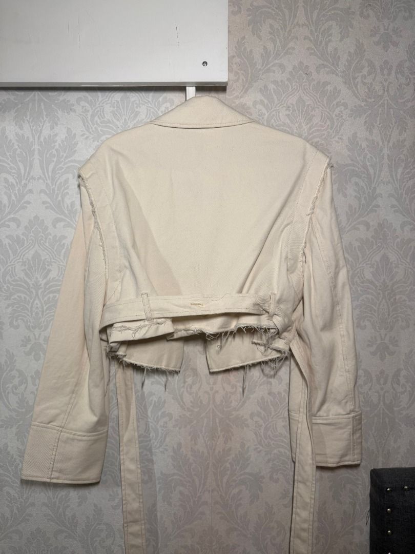 Zara Cropped Jacket with Detachable Sleeves (Category: Coats, Jackets and Outerwear) located in Muntinlupa City. Submitted by clauisstuff (Listing ID 1434916222, Image 2). Description: Zara cream cropped jacket with detachable sleeves - Has buttons on sleeves - Includes a belt - Decorative shoulder details - Raw, frayed hemline RFS: Decluttering MOP: BDO/BPI/GoTyme LOC: Muntinlupa/Taguig.
