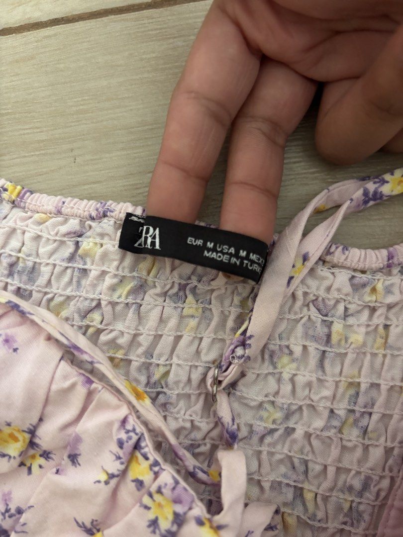 Zara Floral Crop Top (Category: Others Tops) located in Paranaque City. Submitted by preloved_archives (Listing ID 1434885542, Image 3). Description: Zara floral crop top. Size M. Features a pink, purple, and yellow floral print, sweetheart neckline, and button-down front. Made in Turkey..