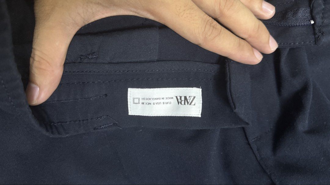 Zara Navy Blue and Black Pants (Category: Jeans) located in Bulacan. Submitted by jemorph (Listing ID 1434897266, Image 3). Description: - Zara pants (navy blue and black) - Size: S - Features: - Button closure - Pockets - Elastic waistband - Navy blue: Made in Bangladesh - Black: Made in Turkey.