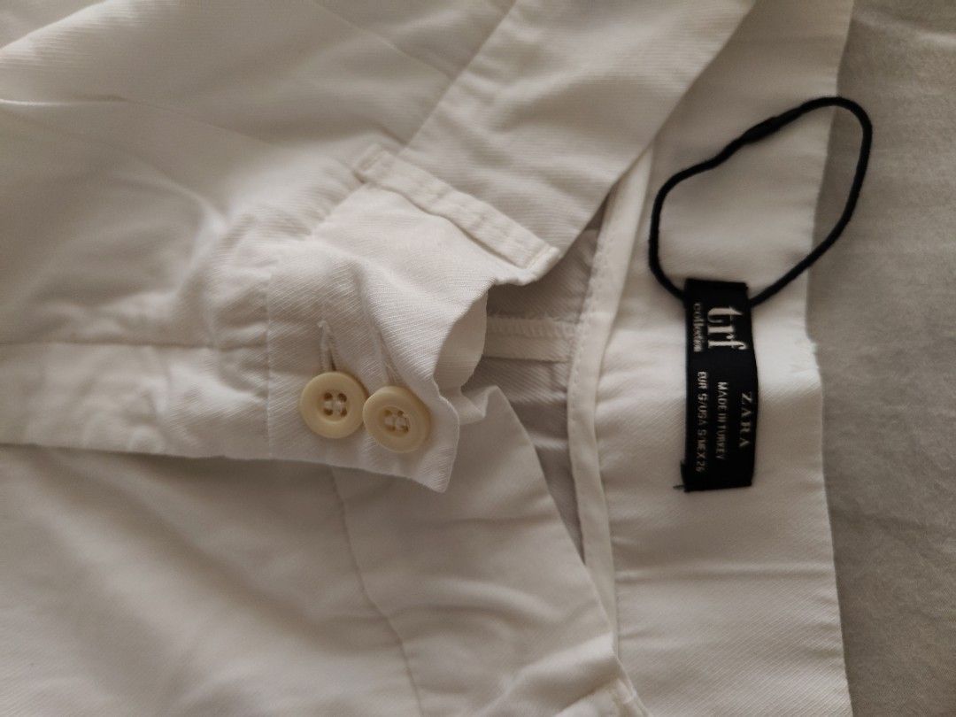 Zara White Wide Leg Pants (Category: Other Bottoms) located in Makati City. Submitted by shopsaleph (Listing ID 1434853114, Image 2). Description: - Zara white wide-leg pants -hem length adjusted to fit petite height ,but temporary hem seams can be removed (see photos) - Button and zipper closure - High-waisted - Two front pockets - Made of lightweight fabric - Perfect for warm weather - Can be styled casually or dressed up #zara #pants #womens #