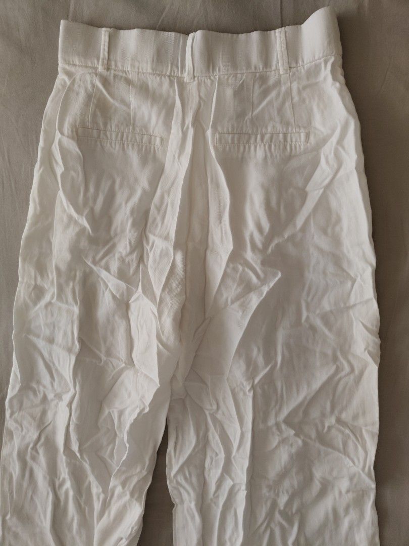 Zara White Wide Leg Pants (Category: Other Bottoms) located in Makati City. Submitted by shopsaleph (Listing ID 1434853114, Image 3). Description: - Zara white wide-leg pants -hem length adjusted to fit petite height ,but temporary hem seams can be removed (see photos) - Button and zipper closure - High-waisted - Two front pockets - Made of lightweight fabric - Perfect for warm weather - Can be styled casually or dressed up #zara #pants #womens #