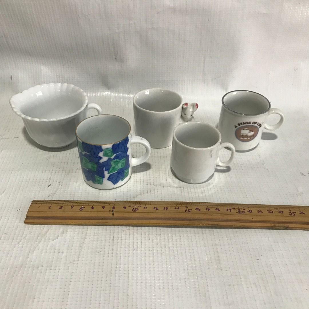 Assorted Ceramic Mini Mugs #4582 (Category: Coffee & Tea Tableware) located in Malabon City. Submitted by mldg.surplus (Listing ID 1435109422, Image 2). Description: - Set of five ceramic mugs - Includes: - White bowl-shaped mug - Mug with blue and green leaf pattern - Plain white mug - Small white mug - Mug with "A Stage of Life" print - Perfect for coffee, tea, or any beverage - Great for gifts or adding to your collection MLDG Surplus Reminder