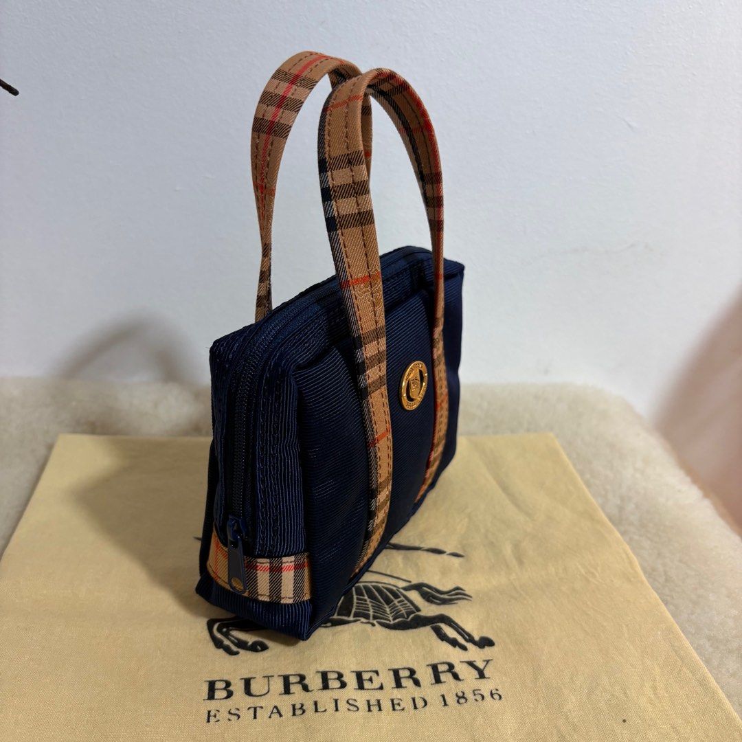 Authentic Burberry’s Japan Mini Handbag (Category: Luxury Bags & Wallets) located in Binangonan. Submitted by makoleksyon (Listing ID 1435126526, Image 2). Description: Excellent condition Like new No flaws Ykk zip kasya phone Bought in Japan 💯% Authentic Money back guarantee.